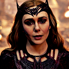 A GIF of Wanda Maximoff in Doctor Strange 2: In The Multiverse of Madness. She is stationary, says "Fine." and then begins walking toward Stephen Strange and America Chavez, who are offscreen.